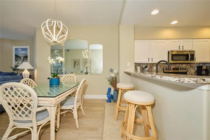 Dining area featuring light hardwood / wood-style floors and a chandelier