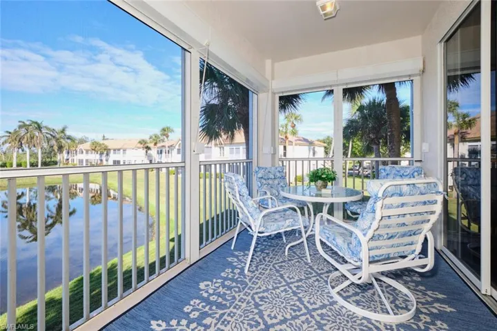 Sunroom with a water view