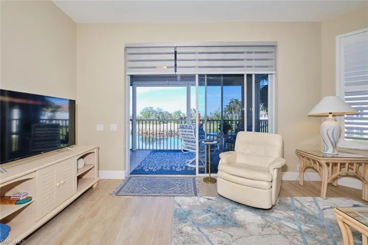 Living room with hardwood / wood-style flooring