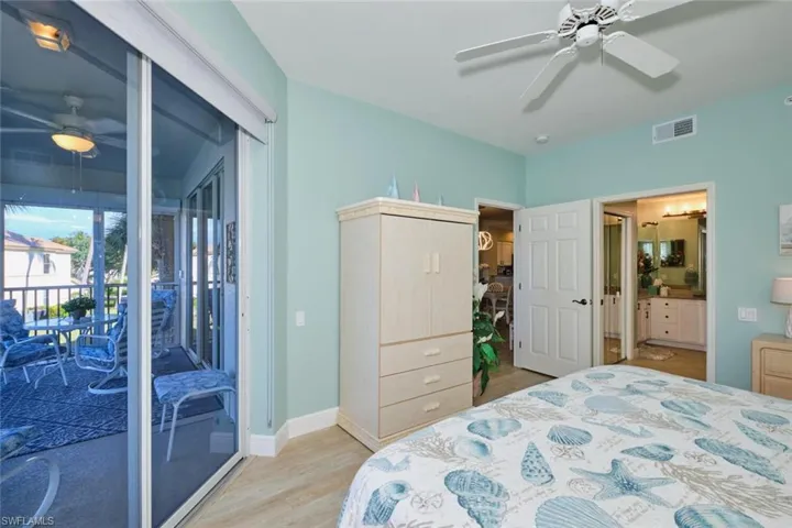 Bedroom featuring access to exterior, ceiling fan, and light hardwood / wood-style floors