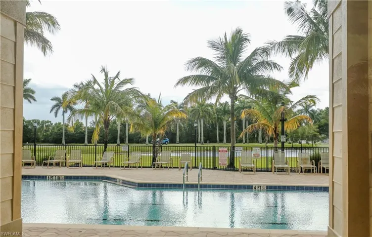 Community pool with a patio