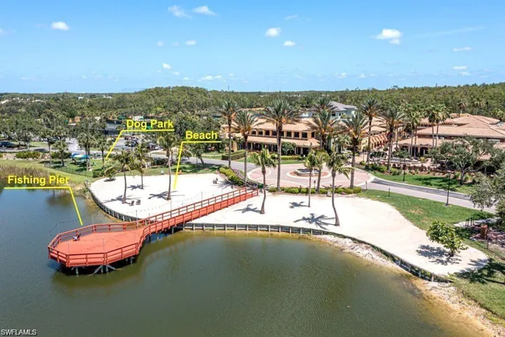 Birds eye view of property with a water view