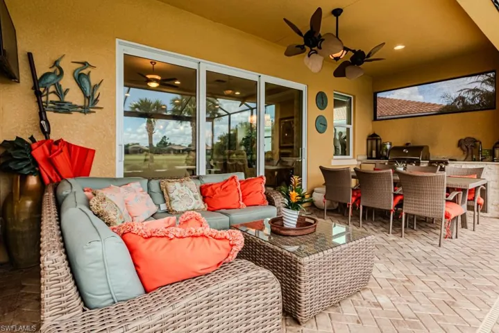 View of patio / terrace with ceiling fan, a grill, and an outdoor hangout area