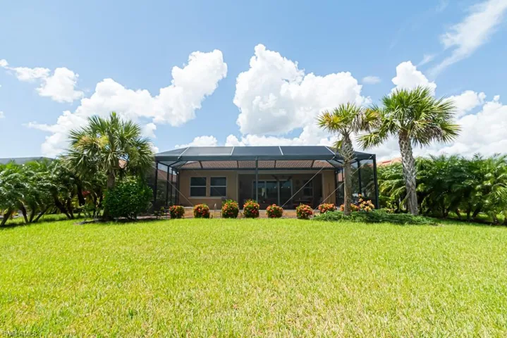 View of yard with a lanai