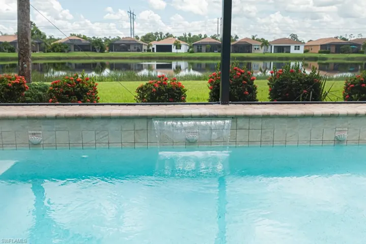View of swimming pool featuring a water view