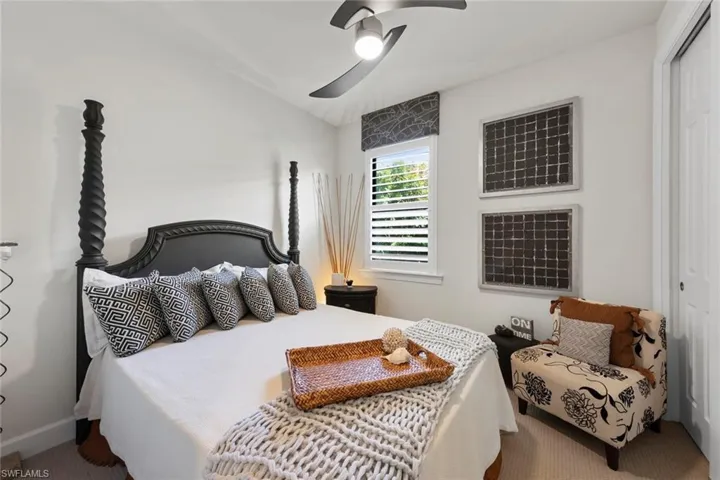 Bedroom featuring ceiling fan, a closet, and carpet flooring