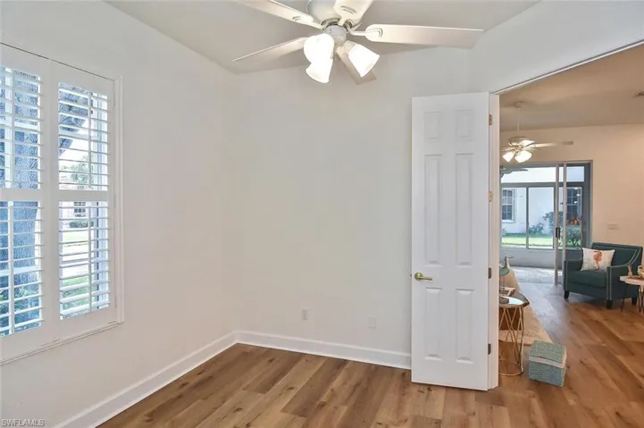 bedroom 2 with wood-style flooring and ceiling fan