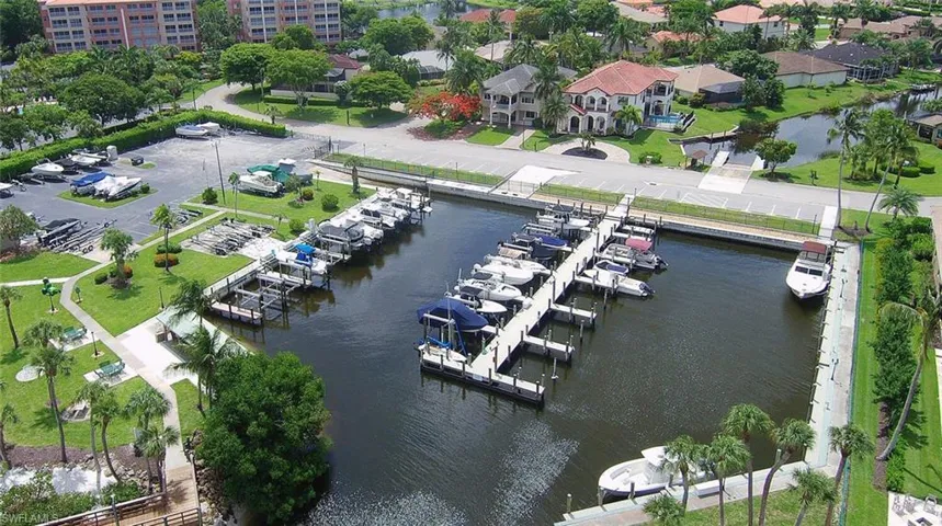 Drone / aerial view featuring a water view and marina