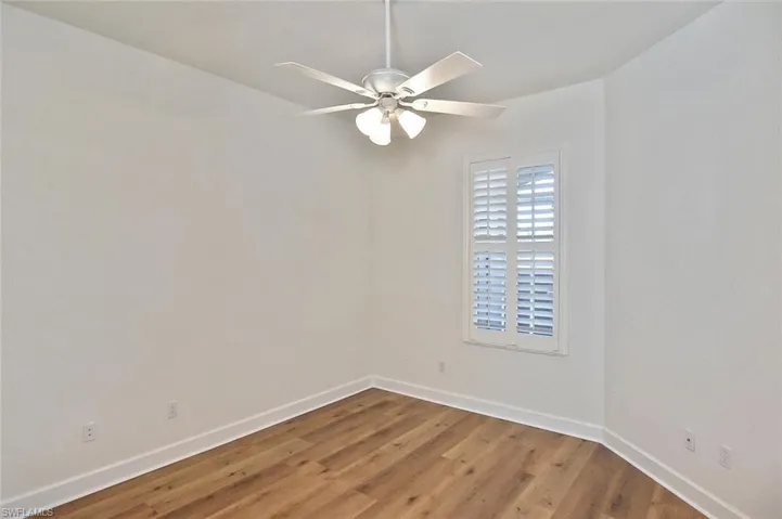 bedroom 3 featuring wood-type flooring and ceiling fan