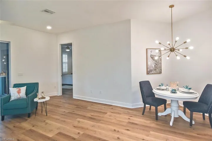 Dining space featuring a chandelier and light hardwood / wood-style floors
