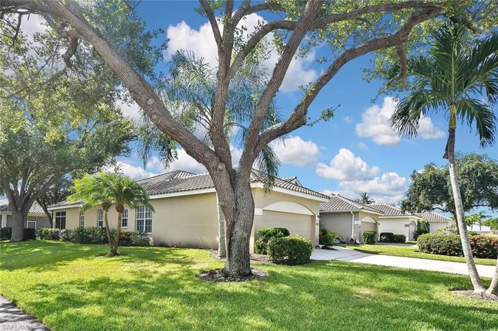 View of front of home featuring a garage and a front lawn