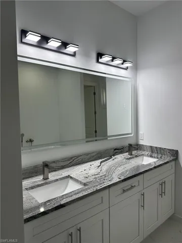 Bathroom featuring double vanity