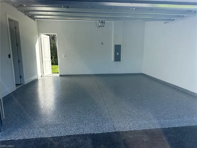 Garage featuring electric panel