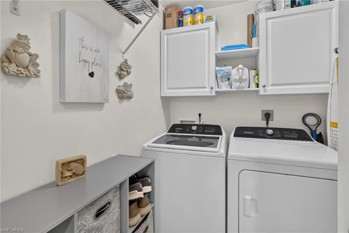 Upper white cabinetry with open shelving, paired with a metal wire shelf