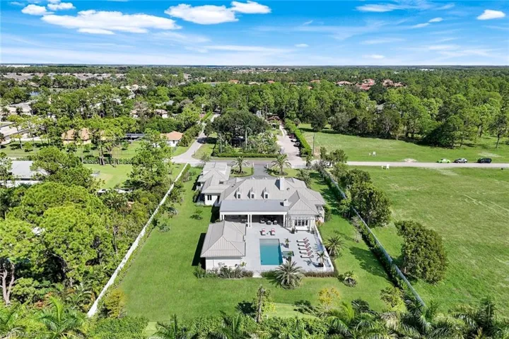 View of subject property with a pool area