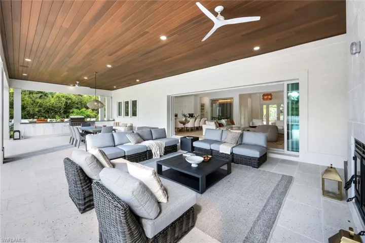View of patio featuring ceiling fan, area for grilling, and outdoor lounge area