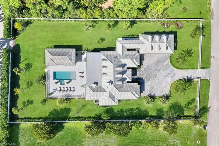 Aerial view of property and surrounding area with property parcel outlined
