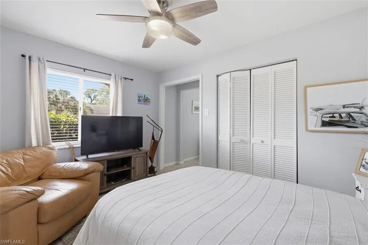Bedroom featuring a closet and a ceiling fan