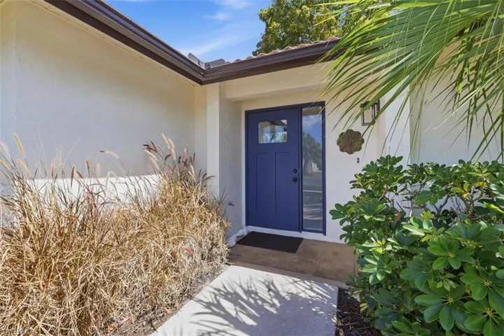 View of exterior entry with stucco siding