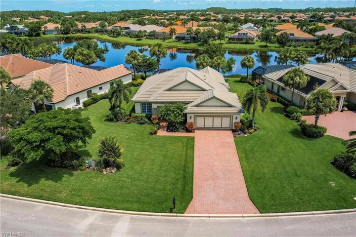 Aerial view of residential area with a nearby body of water