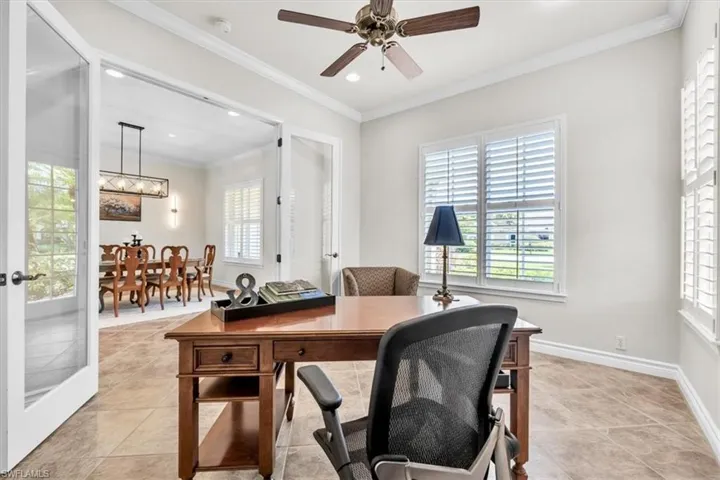 Room featuring tile flooring and crown molding