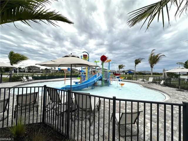 View of splash pad with a patio