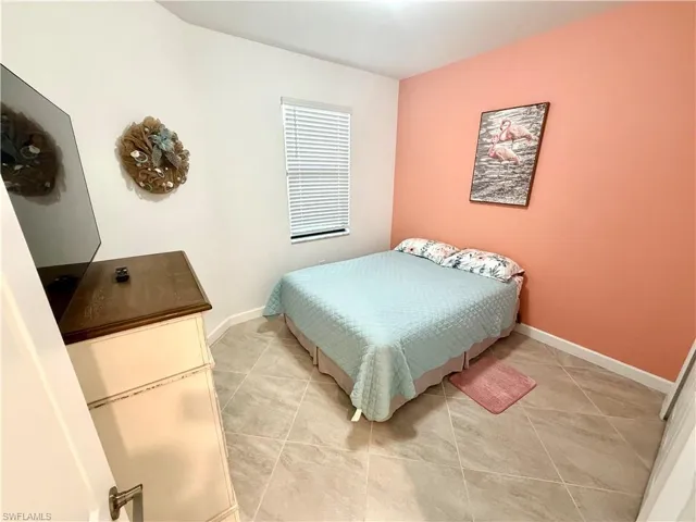 Bedroom 2 featuring light tile patterned flooring