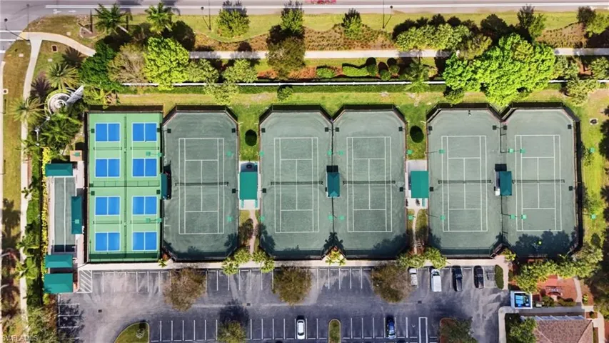 Multiple tennis courts, dedicated pickleball courts, manicured landscaping, and designated parking areas