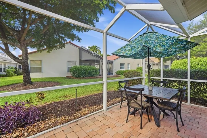 Screened patio featuring brick paver flooring
