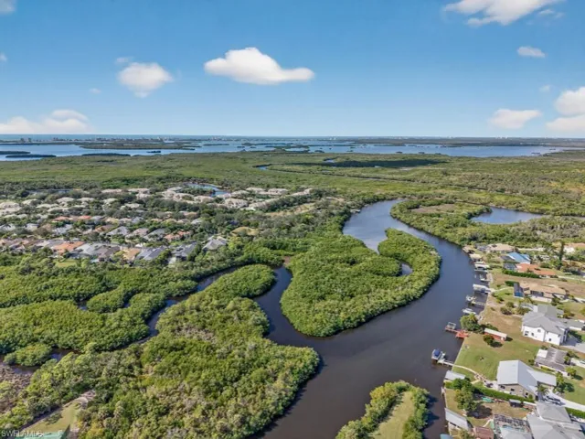 Drone / aerial view of Estero River leading to Gulf of America