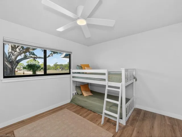 Bedroom featuring light wood-style floors and ceiling fan