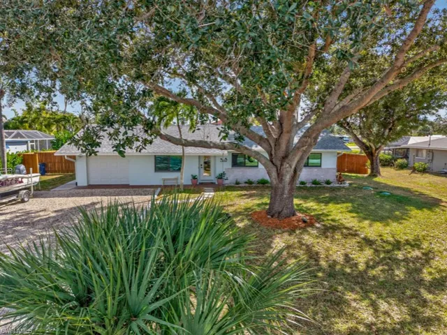 View of front of property featuring driveway and a garage