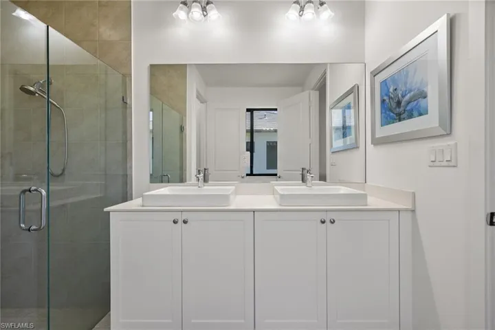 Bathroom featuring vanity and walk in shower