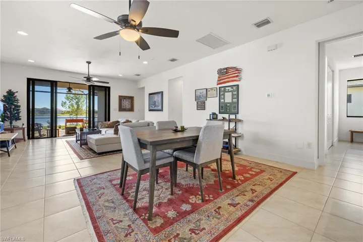 Dining area with ceiling fan and light tile patterned floors