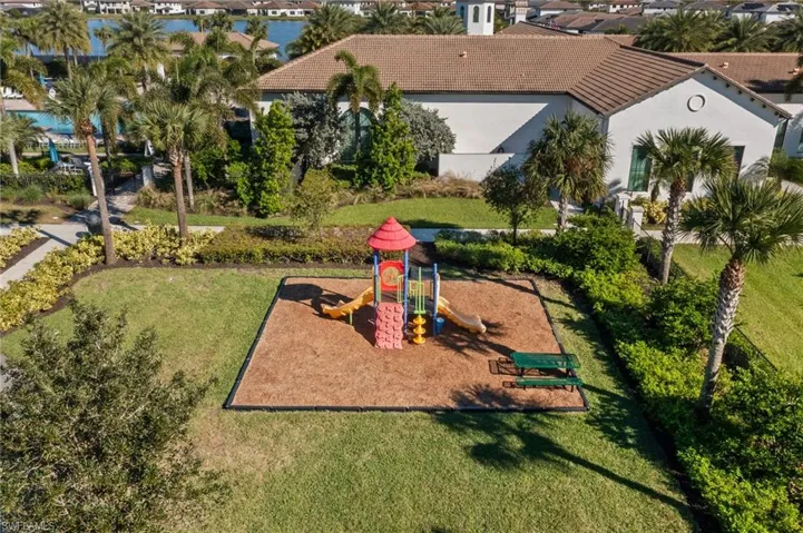 View of jungle gym with a lawn