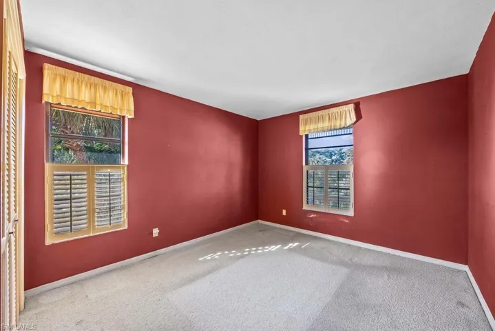 Unfurnished room with carpet flooring