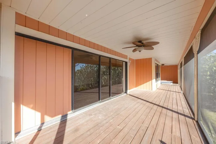 Wooden deck featuring ceiling fan