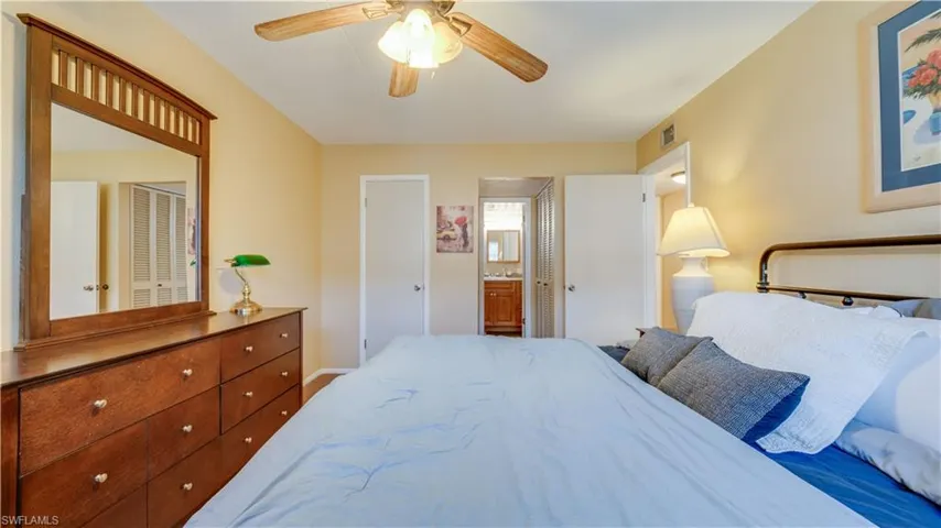 Bedroom with connected bathroom and ceiling fan