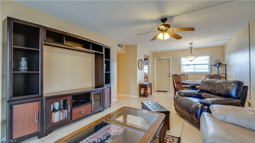 Tiled living room with ceiling fan