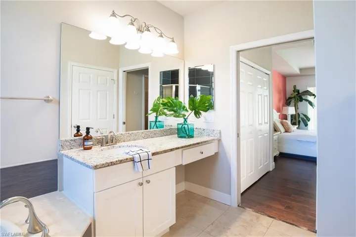 Primary Bathroom featuring double vanities