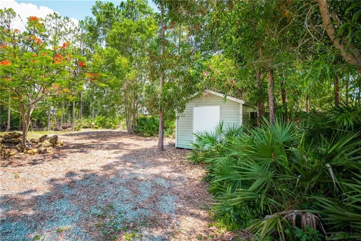 View of yard with a shed
