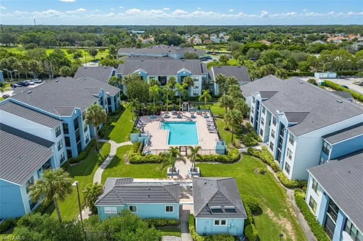 Aerial perspective of suburban area with a pool