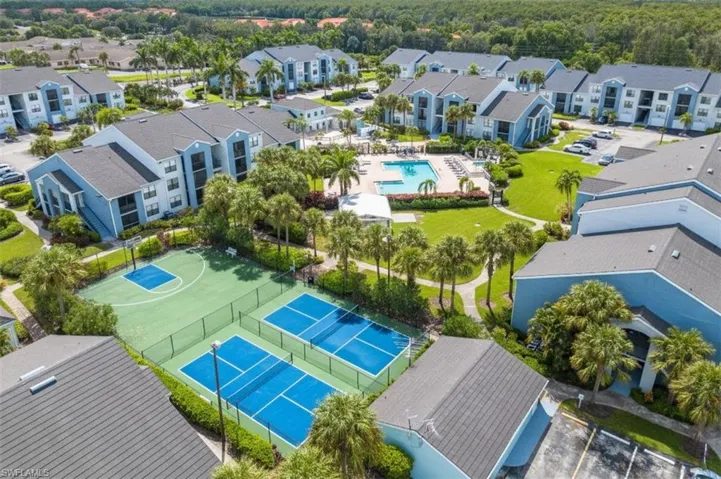 Aerial view of residential area featuring a pool
