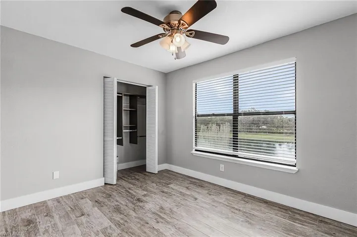 Unfurnished bedroom featuring light wood finished floors and ceiling fan