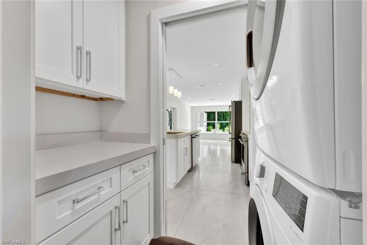 Laundry room located between garage entry and kitchen.