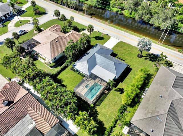 So much yard space! Notice the metal roof.