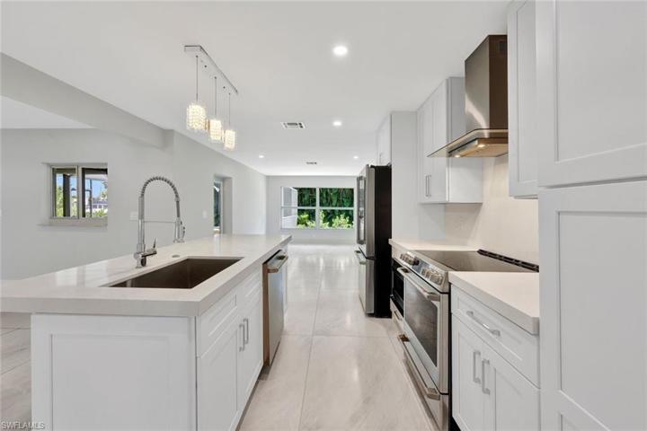 Completely updated kitchen with stainless appliances and quartz countertops.