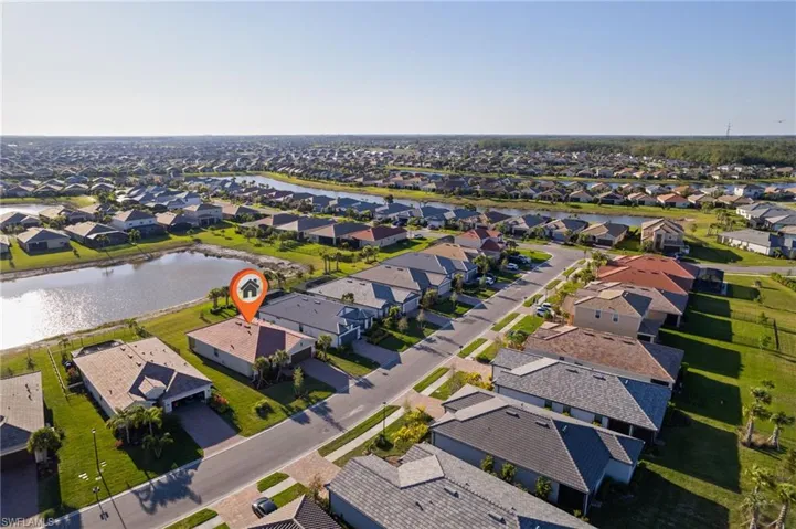Aerial view of residential area with a nearby body of water
