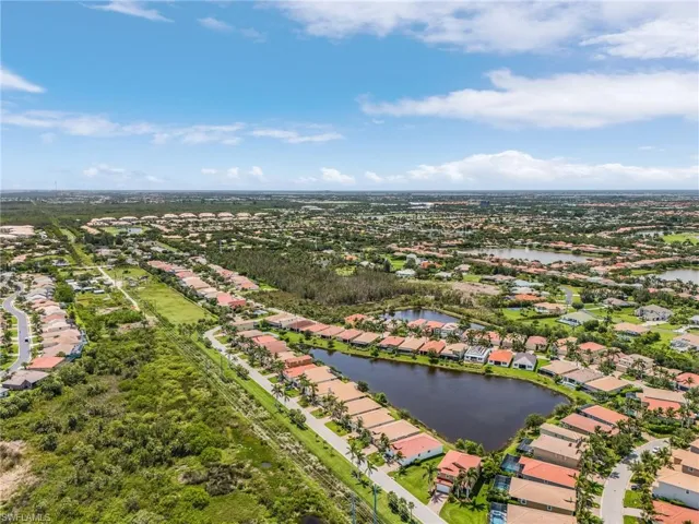 Aerial perspective of suburban area with a large body of water