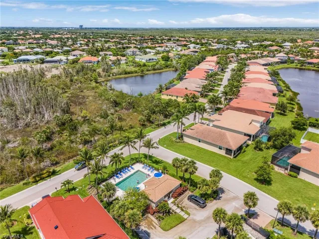 Aerial perspective of suburban area with a large body of water